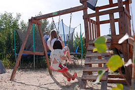 Качели для детей на территории базы отдыха Дача
